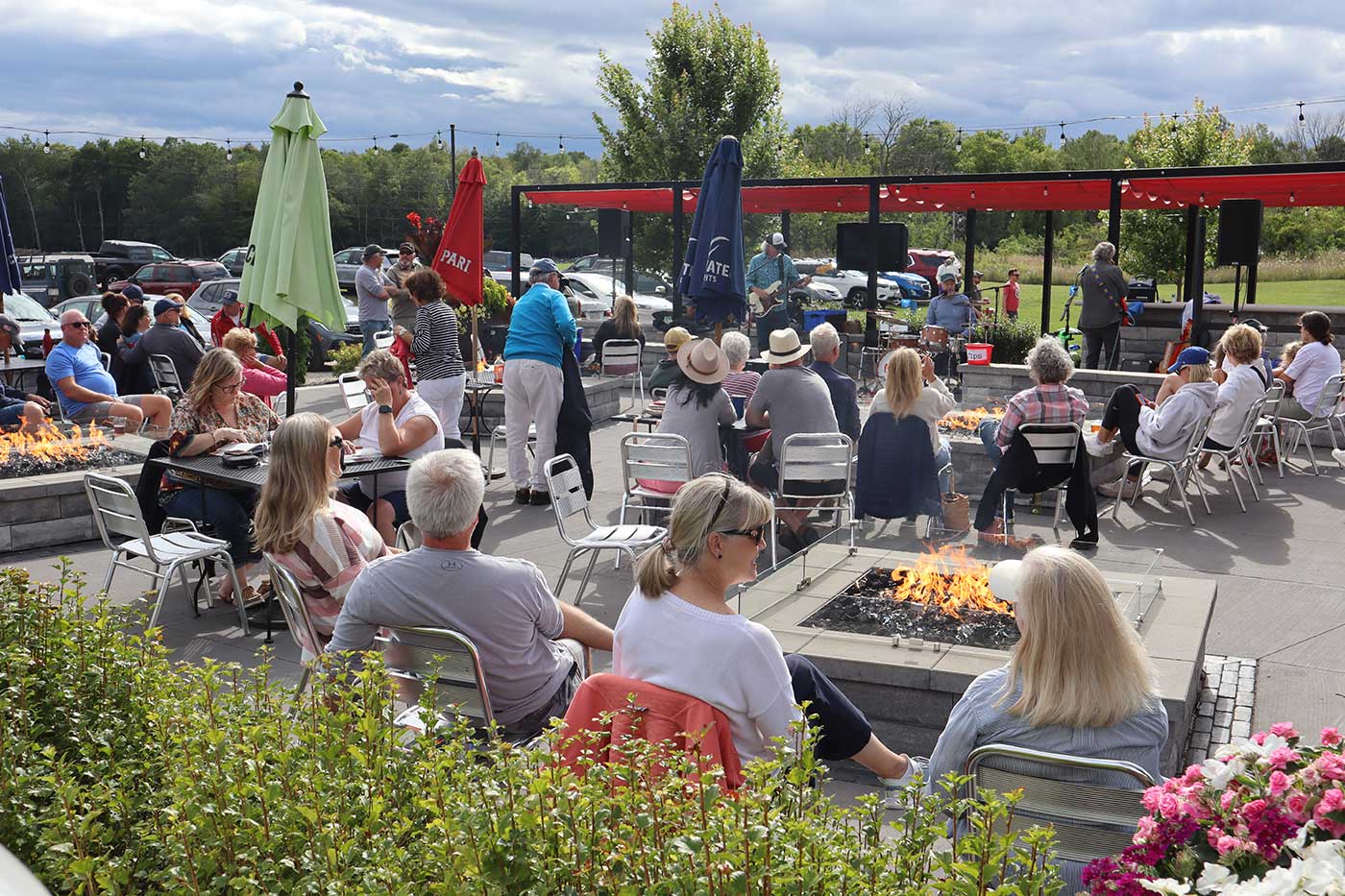 Door County Cherry Hut hosts live music outdoors at night on the heated patio beer garden